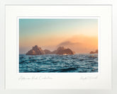 Sunset over ocean with rocky islands, framed artwork