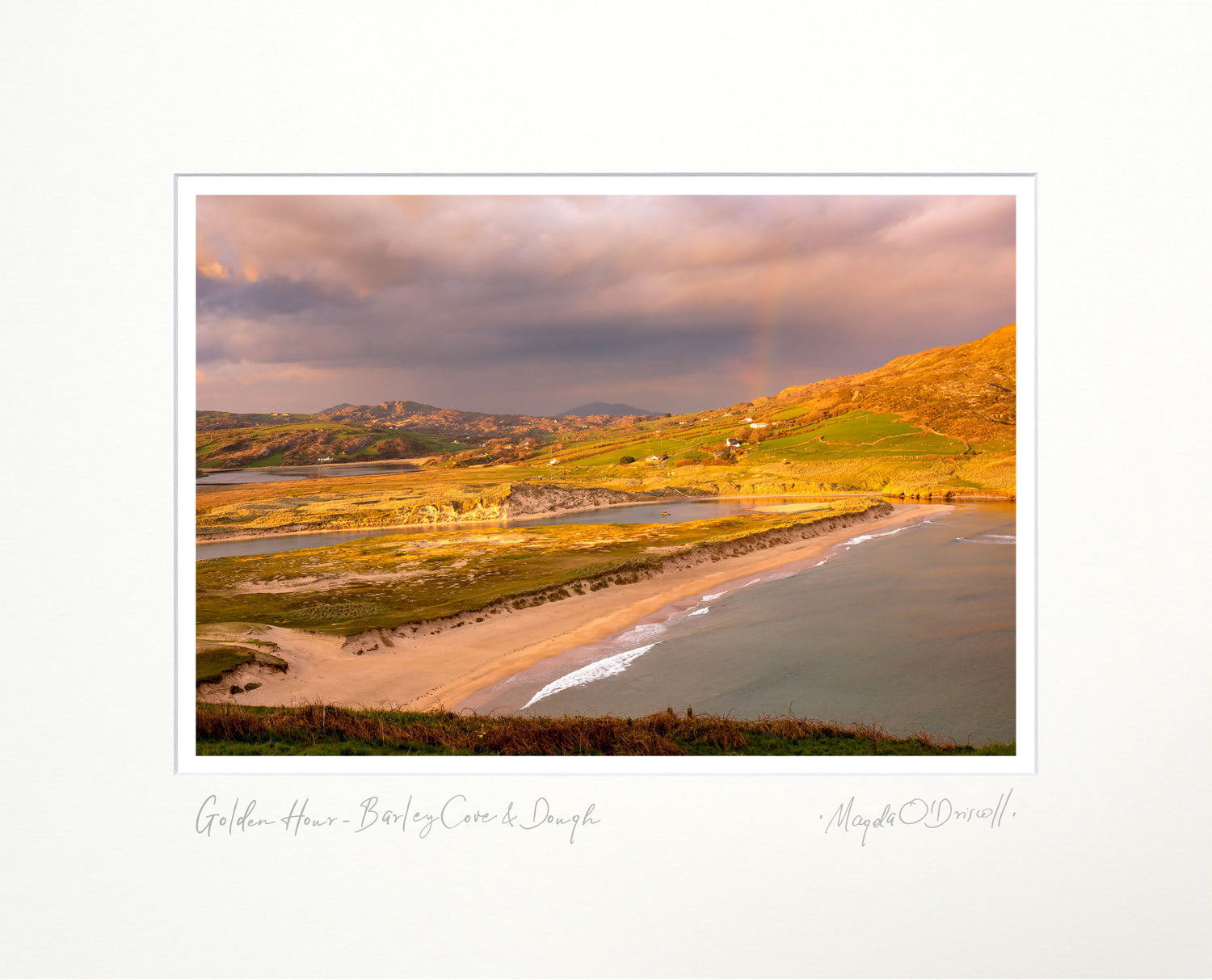 Scenic view of a beach and coastal landscape with a sunset or sunrise.